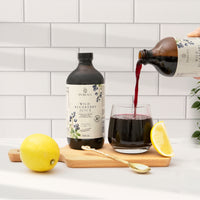 Wild blueberry juice being poured into a glass, an antioxidant rich drink