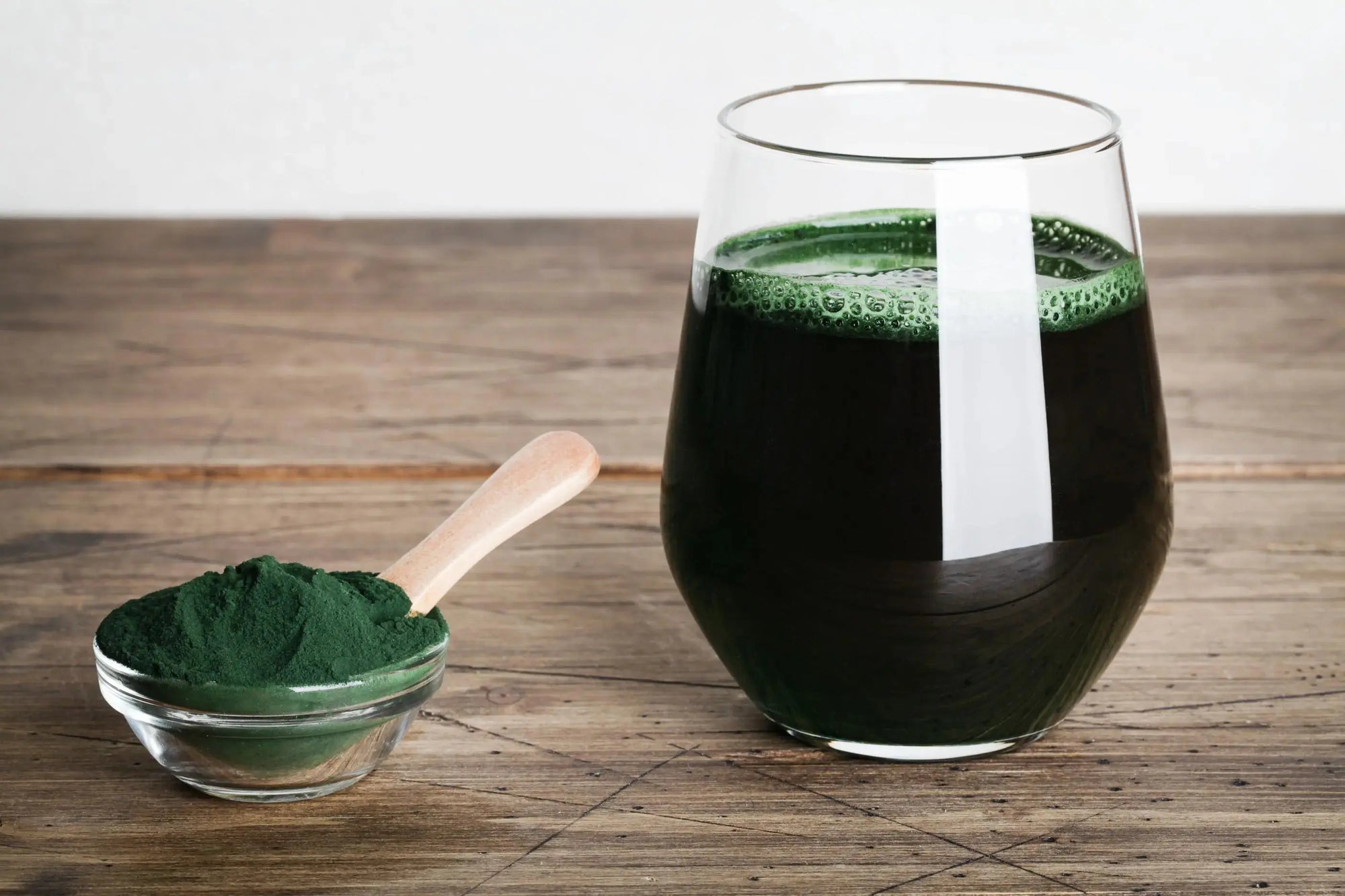 A superfood powder in a dish and a drink made with the same powder.