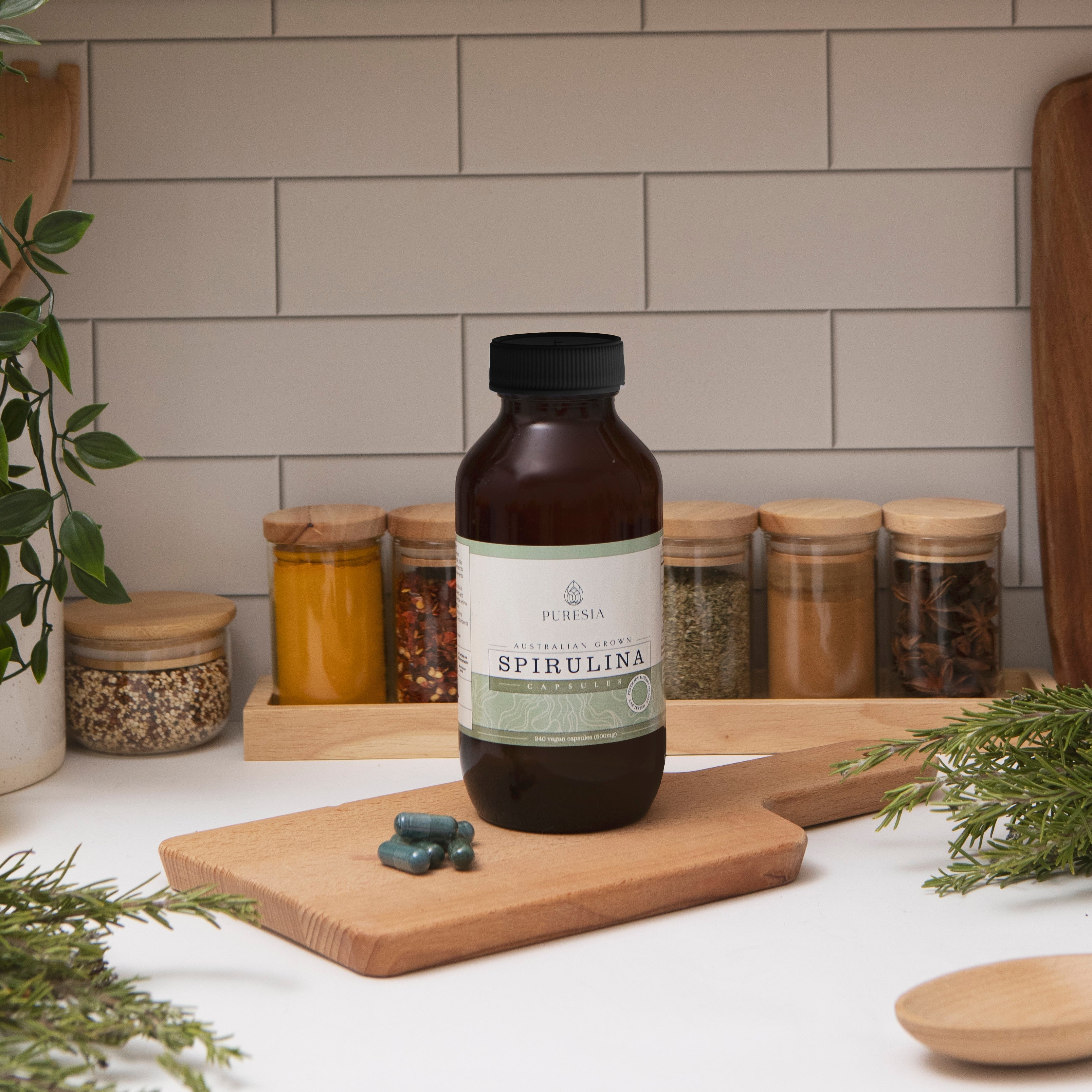 Spirulina capsules on a chopping board