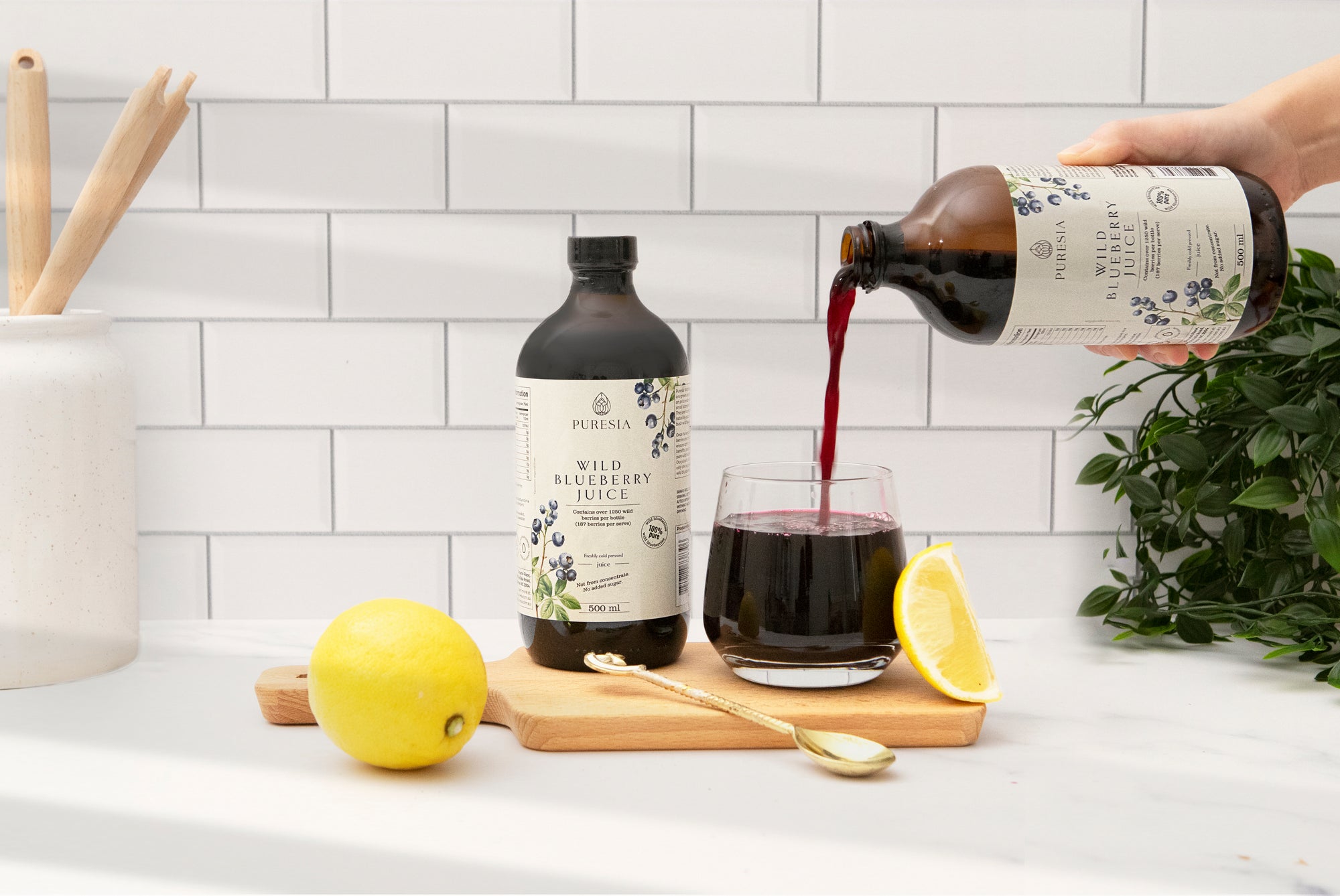 Wild blueberry juice being poured into a glass, an antioxidant rich drink